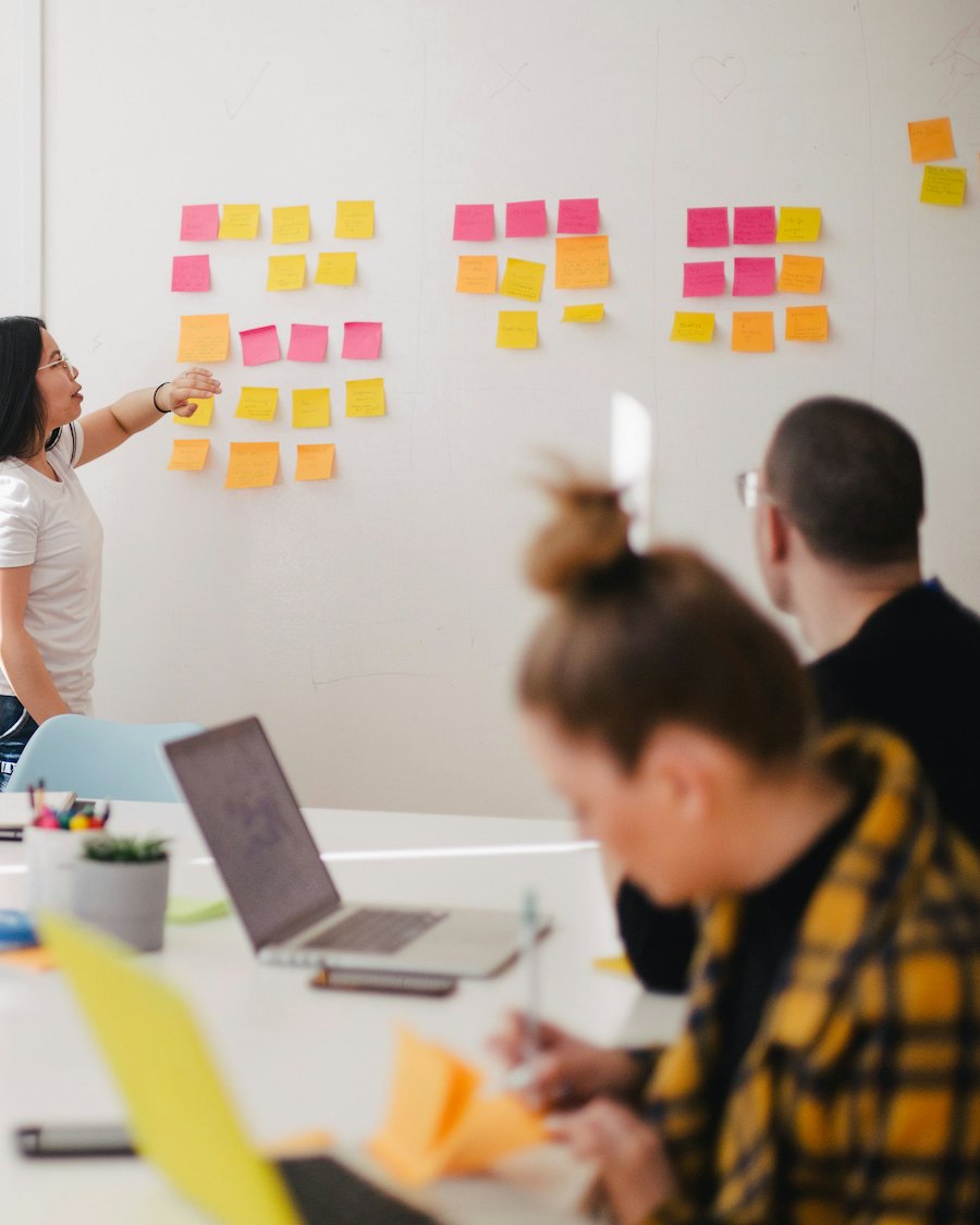 Team planning an enterprise AI agent rollout with sticky notes on a wall
