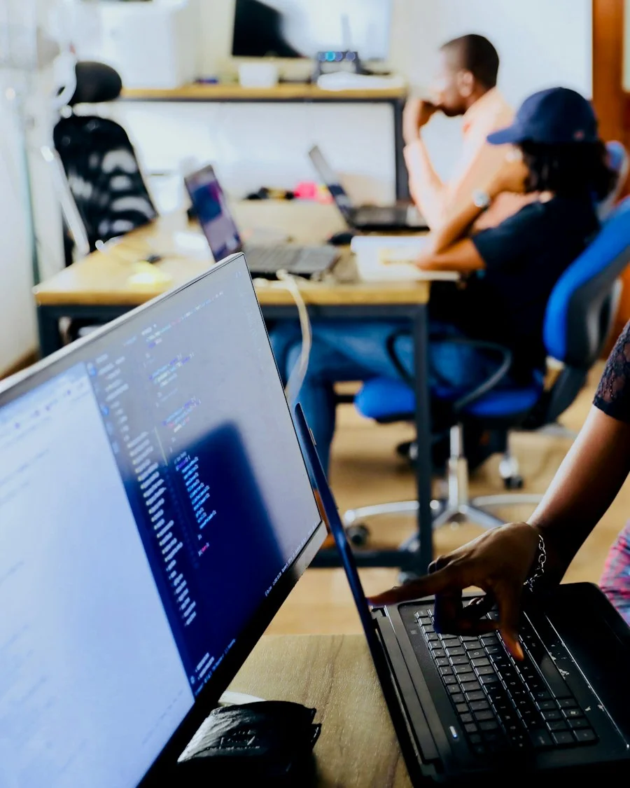 IT support engineers working together at a computer